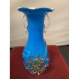A SMALL COLOURED GLASS VASE WITH TWIN HANDLES AND FLORAL RELIEF DESIGN H:20CM