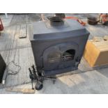 A CAST IRON WOOD BURNING STOVE TO ALSO INCLUDE A FIRE SIDE COMPANION SET