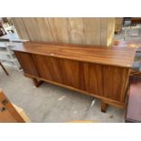 A RETRO HARDWOOD SIDEBOARD ON OPEN BASE ENCLOSING FOUR CUPBOARDS, 71" WIDE