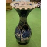A BLUE AND WHITE POTTERY VASE 29CMS
