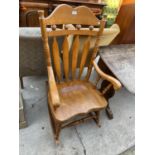 A VICTORIAN STYLE BEECHWOOD ROCKING CHAIR