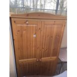 A MODERN PINE TWO DOOR WARDROBE