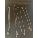 FOUR SILVER NECKLACES