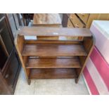 AN OPEN OAK THREE TIER BOOKCASE, 27" WIDE