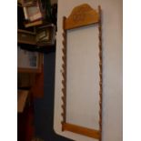 A JAPANESE HARDWOOD TWELVE SWORD RACK, HEIGHT 131CM, WOULD ALSO SUIT WALKING STICKS