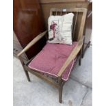 A PARKER KNOLL STYLE SPINDLE-BACK FIRESIDE CHAIR
