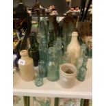 A QUANTITY OF VINTAGE GLASS BOTTLES TO INCLUDE EARTHENWARE ITEMS
