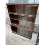 A MID 20TH CENTURY MINTY THREE TIER BOOKCASE WITH SLIDING GLASS DOORS, 35" WIDE