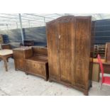 AN EARLY 20TH CENTURY OAK BEDROOM SUITE COMPRISING WARDROBE, TALLBOY, DRESSING TABLE (LACKING