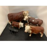 FOUR HEREFORD BULL ORNAMENTS TO INCLUDE A FURTHER SMALL BLACK BULL