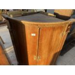 A GEORGE III OAK BOWFRONTED CORNER CUPBOARD WITH DENTIL CORNICE, 32" WIDE