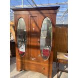 AN EDWARDIAN MAHOGANY AND INLAID MIRROR-DOOR WARDROBE