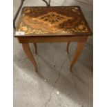 AN ITALIAN STYLE MUSICAL SIDE TABLE WITH HINGED LID AND DECORATIVE DESIGN