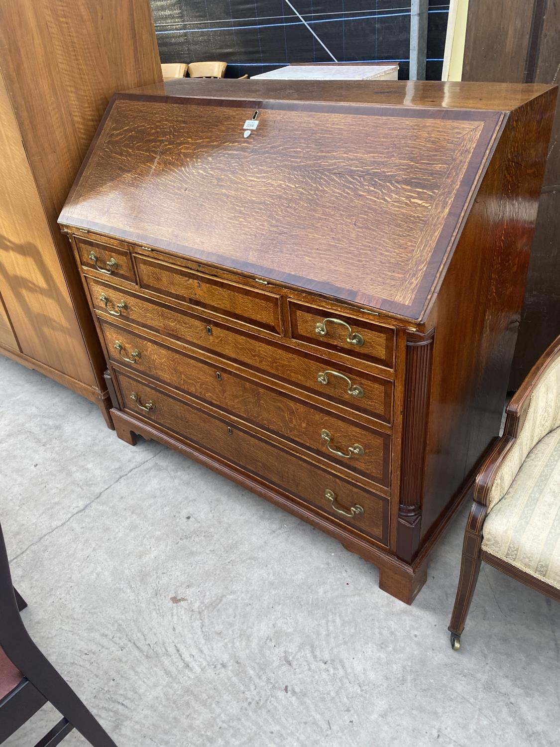 A GEORGE III OAK AND CROSSBANDED FALL FRONT BUREAU WITH FITTED INTERISOR, 45.5" WIDE