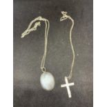 TWO SILVER NECKLACES WITH PENDANTS TO INCLUDE A CROSS AND A GREY STONE