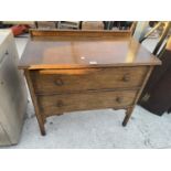 AN EARLY 20TH CENTURY OAK CHEST OF TWO DRAWERS