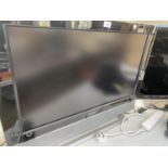 A HUMAX 32" TELEVISION BELIEVED IN WORKING ORDER BUT NO WARRANTY