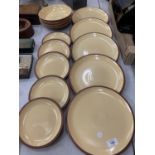 A COLLECTION OF DENBY DINNER PLATES, SIDE PLATES AND BOWLS