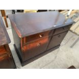 A STAG MINSTREL SIDE CABINET ENCLOSING TWO DRAWERS AND TWO CUPBOARDS, 38" WIDE