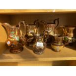 AN ASSORTMENT OF LUSTRE WARE COPPER JUGS