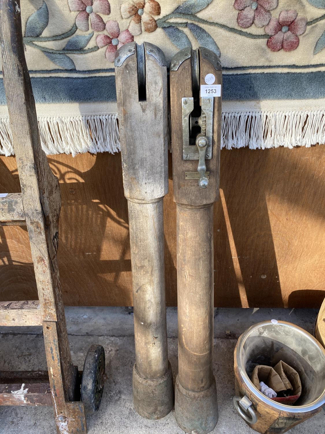 A PAIR OF VINTAGE WOODEN TENNIS NET POSTS