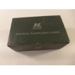 A BOXED NCSTAR TACTICAL FLASHLIGHT/LASER