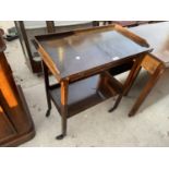 AN EARLY 20TH CENTURY MAHOGANY GALLERY TOP TEA TROLLEY WITH FOLD-OVER GAMES TOP