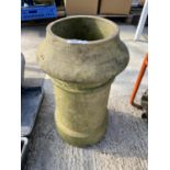 A ROUND STONE CHIMNEY POT