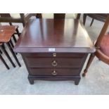 A STAG MINSTREL BEDSIDE CHEST OF TWO DRAWERS WITH SLIDE