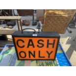 AN ILLUMINATED 'CASH ONLY' SIGN