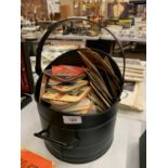 A COAL SCUTTLE CONTAINING A QUANTITY OF VINTAGE BEER MATS