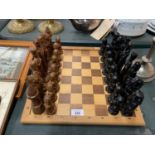 A WOODEN EGYPTIAN THEME CHESS SET