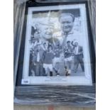 A SIGNED AND FRAMED PICTURE OF TOMMY DOCHERTY AND RON ATKINSON