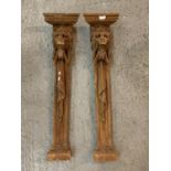 A PAIR OF WOODEN LION HEAD POSTS