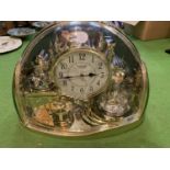 A RHYTHM QUARTZ HALF MOON MANTEL CLOCK