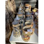 A LARGE COLLECTION OF CERAMIC LIDDED STEINS