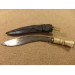 A BONE HANDLED KUKRI KNIFE, 23CM BLADE, WITH SCABBARD AND KARDA KNIVES