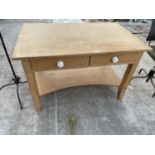 A PINE DESK ENCLOSING 2 SHORT DRAWERS