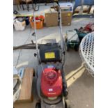 A HONDA EASY START PETROL ENGINE LAWN MOWER WITH GRASS BOX BELIEVED IN WORKING ORDER BUT NO WARRANTY