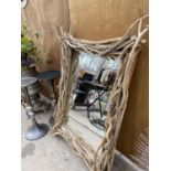 A LARGE UNUSUAL DRIFT WOOD FRAMED MIRROR