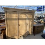 A VICTORIAN PINE THREE DOOR CUPBOARD ON OPEN BASE, 72" WIDE, 18" DEEP AND 72" HIGH