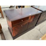 A STAG MINSTREL SIDE CABINET ENCLOSING TWO DRAWERS AND TWO CUPBOARDS, 38" WIDE