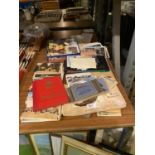 A COLLECTION OF POSTCARDS, STAMPS, SOUVENIR BOOKLETS ETC