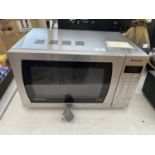 A PANASONIC MICROWAVE OVEN BELIEVED IN WORKING ORDER BUT NO WARRANTY