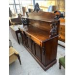 A VICTORIAN STYLE CHIFFONIER WITH THREE FRIEZE DRAWERS AND THREE PANELLED DOORS TO THE BASE,