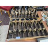 AN EXTREMELY DECORATIVE BRASS CHESS SET