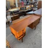 A RETRO TEAK DRESSING TABLE WITH TWO LONG AND FOUR SMALL DRAWERS, 57.5" WIDE