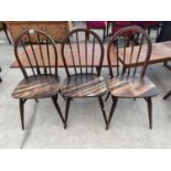 THREE ERCOL SPINDLE BACK DINING CHAIRS