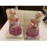 A PAIR OF ROYAL DOULTON 'BRIDESMAID' BOOKENDS