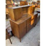 A RETRO NATHAN TEAK SIDEBOARD WITH SIX CUPBOARDS, TWO DRAWERS AND SLIDING GLASS DOORS, 54" WIDE